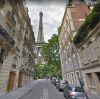 france-paris-eiffel-tower-among-the-buildings-nearby-street-and-woman-G6K657.jpg
