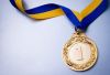 depositphotos_61836533-stock-photo-gold-medal-on-blue.thumb.jpg.d422c71ea253d2e0af10349f75507b2b.jpg