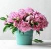 depositphotos_199032960-stock-photo-bucket-beautiful-peony-flowers-table.jpg